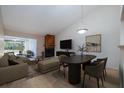 Open-concept living room with wood-burning fireplace and lots of natural light at 120 Black Duck Cir, Daytona Beach, FL 32119