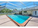 Enjoy this screened-in pool area, perfect for entertaining and relaxation in the Florida sun at 19 Twin River Dr, Ormond Beach, FL 32174
