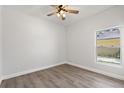 Bright bedroom features natural light from a window and stylish wood-look flooring at 226 N Frederick Ave, Daytona Beach, FL 32114