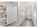 Inviting foyer with wood-look floors leading to a modern bathroom with marble and a shower at 226 N Frederick Ave, Daytona Beach, FL 32114