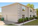 Side view of house with attached garage and manicured lawn at 2479 Vaughn Ave, Deltona, FL 32725