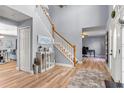 Inviting foyer with high ceilings, light wood floors, and staircase at 2479 Vaughn Ave, Deltona, FL 32725