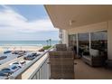 Cozy balcony with seating overlooking the beach and parking at 2967 S Atlantic Ave # 301, Daytona Beach Shores, FL 32118