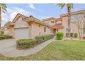 Charming home featuring a Spanish tile roof, landscaped yard, and an attached two-car garage at 3145 Connemara Dr, Ormond Beach, FL 32174
