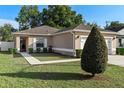 Charming single-story home with a well-kept lawn and inviting curb appeal at 3825 Arborvitae Way, Deland, FL 32724