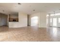 Spacious living room with tile floors seamlessly connects to the kitchen area at 69 Grey Dapple Way, Ormond Beach, FL 32174