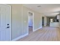 Open-concept living space with sleek flooring, recessed lighting and modern finishes throughout at 709 Cedar St, Daytona Beach, FL 32114