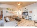 Comfortable living room with tile flooring, high ceilings, and nautical decor at 811 Smokerise Blvd, Port Orange, FL 32127