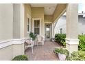 Cozy front porch with seating and a decorative wreath, creating a welcoming entrance to the home at 1684 Victoria Gardens Dr, Deland, FL 32724