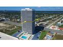 Condo building with a modern design offering pool and views of neighborhood at 2200 N Atlantic Ave # 1201, Daytona Beach, FL 32118