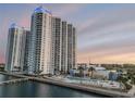 Beautiful view of the condo buildings from the water featuring a pool and waterfront boardwalk at 241 Riverside Dr # 601, Daytona Beach, FL 32117