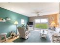 Cozy living room with ocean views, comfortable seating, and natural light for relaxation at 2480 Ocean Shore Blvd # 120, Ormond Beach, FL 32176