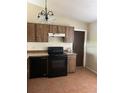 Kitchen features an oven, dishwasher, tile floor and range hood at 2684 Candler Dr, Deltona, FL 32725