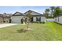 Charming single-story home with well-manicured lawn at 3845 Arborvitae Way, Deland, FL 32724