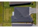 Birds-eye view of a home showing the roof, fenced backyard, a small patio with chairs, and well-maintained landscaping at 418 Aquamarine Way, Daytona Beach, FL 32124