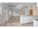 Bright, open living space featuring a ceiling fan and view of the kitchen area at 782 Valencia Ave, Orange City, FL 32763