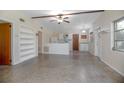 Spacious living area with open floor plan, built-in shelves, and kitchen view at 782 Valencia Ave, Orange City, FL 32763