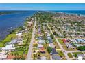 Aerial view showcasing the home's location near ocean and riverfront in a lively residential neighborhood at 863 Riverside Dr, Ormond Beach, FL 32176