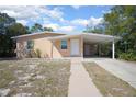 Attractive single-Gathering home with a covered carport, offering convenient parking at 954 Chippendale St, Deltona, FL 32725