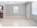 Bright room featuring neutral walls, tile floors, and a window for ample natural light at 954 Chippendale St, Deltona, FL 32725