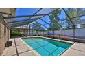 Sparkling screened-in pool with ample deck space for entertaining and relaxing at 1 Fox Hollow Dr, Ormond Beach, FL 32174