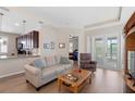 Comfortable living room with an open floor plan and access to the outdoor space at 1088 Avery Meadows Way, Deland, FL 32724