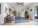 Bright living room features a ceiling fan, open floor plan, and a dining area at 120 Hibiscus Woods Ct # 2A, Deltona, FL 32725