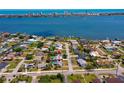 Picturesque aerial view showcasing home's proximity to the water and nearby city skyline at 150 Nautical Dr, South Daytona, FL 32119