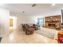 Spacious living room with tile floors, brick fireplace, and comfortable seating at 2309 6Th Ave, Deland, FL 32724