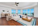Bright living room with ocean view, comfortable seating, and stylish decor at 2855 S Atlantic Ave # 303, Daytona Beach Shores, FL 32118