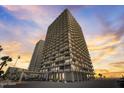 Exterior elevation shot of a tall beachfront building with multiple balconies at sunset at 2900 N Atlantic Ave # 2003, Daytona Beach, FL 32118