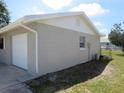 Exterior shot of the home featuring a garage and a clean architectural style at 2936 Lantern Dr, South Daytona, FL 32119