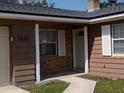 Inviting front entrance with white columns and shutters on a well-maintained exterior at 3259 Ellwood Ct, Winter Park, FL 32792