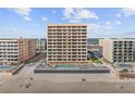 Oceanfront condo building with pool deck and beach access at 3799 S Atlantic Ave # 601, Daytona Beach, FL 32118