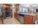 Well-appointed kitchen with stainless steel appliances, granite countertops, and ample cabinet space at 3799 S Atlantic Ave # 601, Daytona Beach, FL 32118