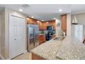 Well-equipped kitchen features stainless steel appliances, granite countertops, and wood cabinetry at 3799 S Atlantic Ave # 601, Daytona Beach, FL 32118