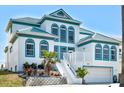 Beautiful two-story home with a two-car garage and tropical landscaping at 4363 S Atlantic Ave, Ponce Inlet, FL 32127