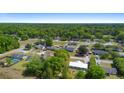 Aerial view of a residential neighborhood with mature landscaping, single Gathering homes and convenient access to nearby amenities at 4836 Ne 26Th Ter, Ocala, FL 34479