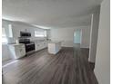 Open kitchen with new appliances flows into a spacious living area at 508 N Keech St, Daytona Beach, FL 32114