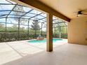 Spacious screened-in lanai with a relaxing pool featuring a rock waterfall, offering the perfect space for outdoor entertainment at 669 E Victoria Trails Blvd, Deland, FL 32724