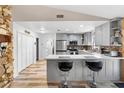 Modern kitchen with gray cabinets, stainless steel appliances, and a stylish breakfast bar at 1560 S Pearl St, Deland, FL 32720