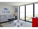 Bright living room boasts large windows with scenic views and comfortable seating at 1 Oceans West Blvd # 20B4, Daytona Beach, FL 32118