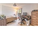 Cozy bedroom featuring neutral tones, comfortable bed, and functional workspace with modern desk at 124 Golden Eye Dr # A, Daytona Beach, FL 32119