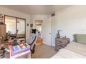 Functional bedroom with mirrored closet, study area and soothing color palette at 124 Golden Eye Dr # A, Daytona Beach, FL 32119