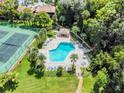 Aerial view of the sparkling community pool and tennis court at 168 Perimeter Ct # 5B, Deltona, FL 32725