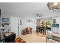 Cozy dining area with tile floors, modern lighting, and a view to the outside at 219 Brevity Ln, Deland, FL 32724