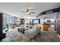 Spacious living room with hardwood floors and sliding doors leading to a balcony at 241 Riverside Dr # 1909, Daytona Beach, FL 32117
