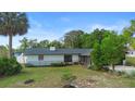 An aerial view of a single-story home with mature landscaping in the front yard with a nice backyard at 265 S Fairbairn Dr, Deltona, FL 32725