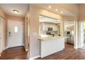 Bright and airy kitchen featuring stainless steel appliances, white cabinetry, and a breakfast bar at 2819 Silver Palm Dr, Edgewater, FL 32141