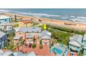 Aerial view of beach home with a pool and a beachfront location at 3000 Ocean Shore Blvd # 6, Ormond Beach, FL 32176